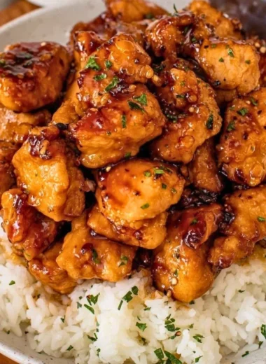 Plate of 20 Minute Honey Garlic Chicken Bites garnished with green onions.