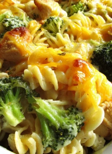 Baked Cheesy Broccoli Chicken Noodle Casserole in a casserole dish