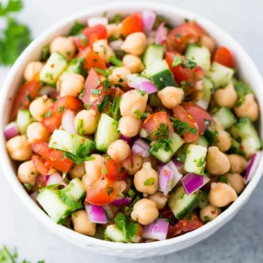 Delicious chickpea salad with fresh vegetables and dressing