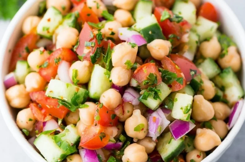 Delicious chickpea salad with fresh vegetables and dressing