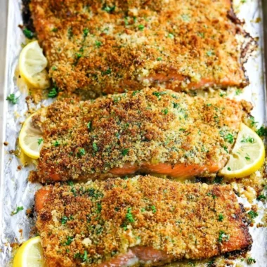 Crispy garlic parmesan salmon garnished with herbs on a plate