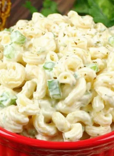 Deli-style macaroni salad in a bowl, garnished and ready to serve.
