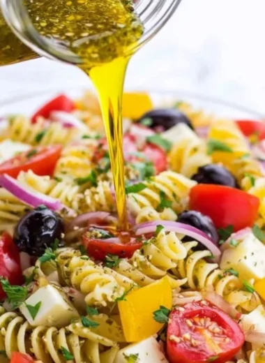 Bowl of homemade Italian dressing with fresh herbs and spices