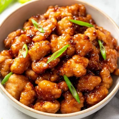Delicious Honey Butter Chicken served with a side of crispy fries