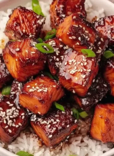 Honey garlic salmon bites bowl with fresh vegetables and rice