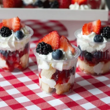 Delicious mini shortcake cups topped with fresh berries and whipped cream
