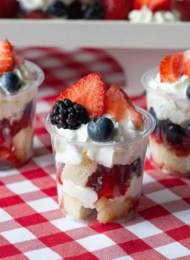 Delicious mini shortcake cups topped with fresh berries and whipped cream