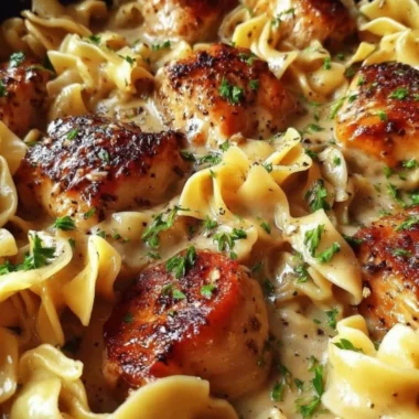 One-Pan Creamy Garlic Butter Chicken served with egg noodles.
