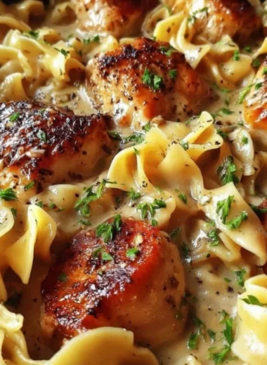 One-Pan Creamy Garlic Butter Chicken served with egg noodles.