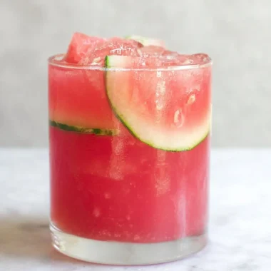 Refreshing watermelon cocktail punch served in a glass with mint garnish