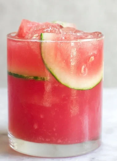 Refreshing watermelon cocktail punch served in a glass with mint garnish