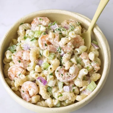 Delicious Shrimp Pasta Salad garnished with fresh herbs and colorful vegetables