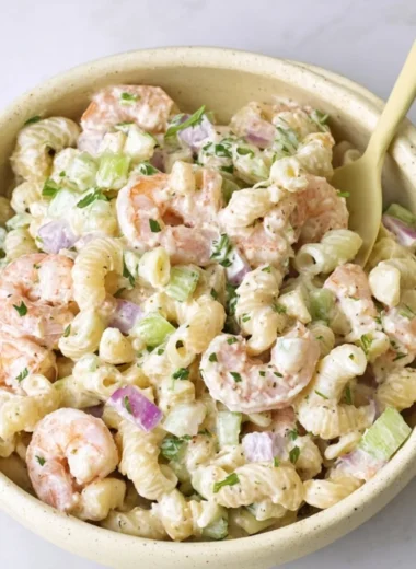 Delicious Shrimp Pasta Salad garnished with fresh herbs and colorful vegetables