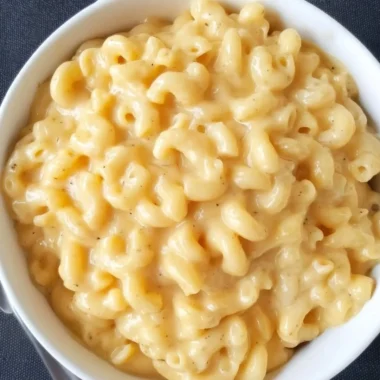 Bowl of homemade Simple Mac and Cheese with creamy cheese sauce and pasta.