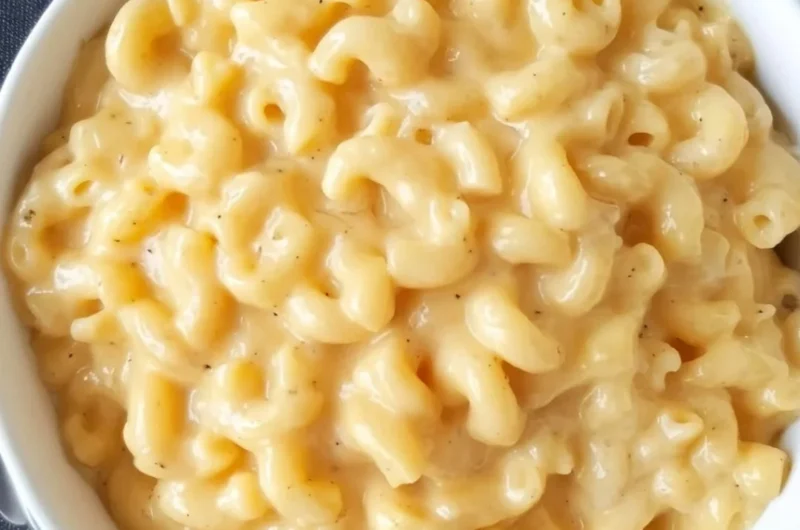 Bowl of homemade Simple Mac and Cheese with creamy cheese sauce and pasta.