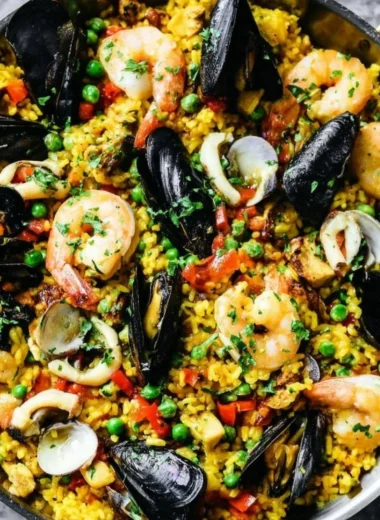 A traditional dish of authentic paella served with seafood and fresh vegetables