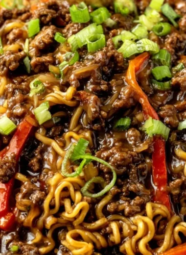 Delicious beef ramen noodles stir fry served in a bowl with fresh vegetables