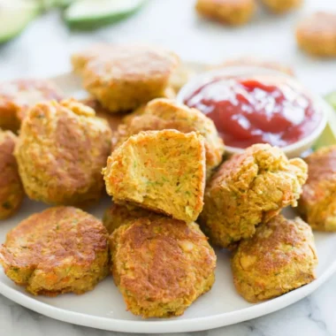 Plate of crispy chickpea nuggets served with dipping sauce