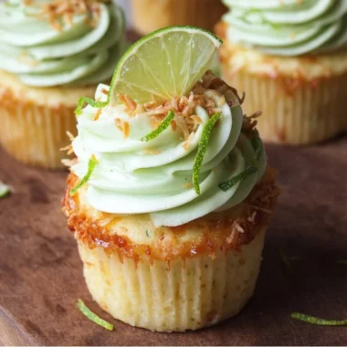Coconut cupcakes with lime buttercream frosting on a beautiful display