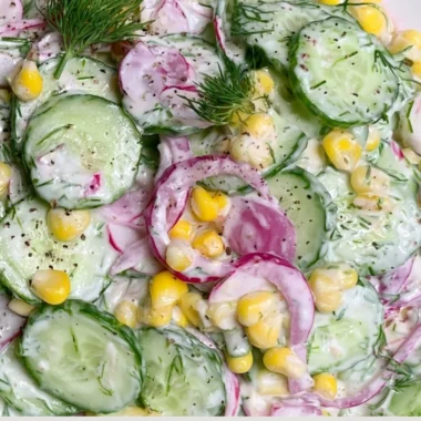 A vibrant colorful summer salad with fresh vegetables and fruits