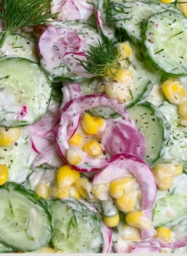 A vibrant colorful summer salad with fresh vegetables and fruits