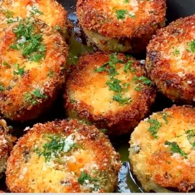 Plate of crispy breaded eggplant garnished with herbs