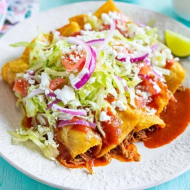 Crispy golden tacos with fresh toppings and vibrant colors