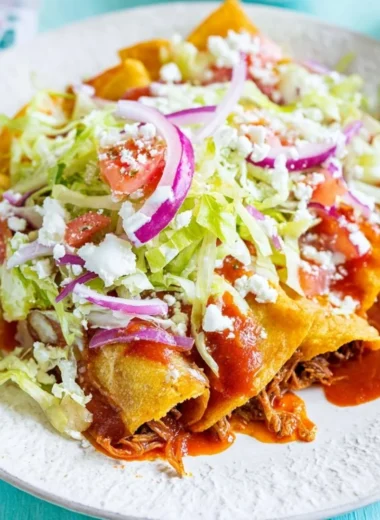 Crispy golden tacos with fresh toppings and vibrant colors