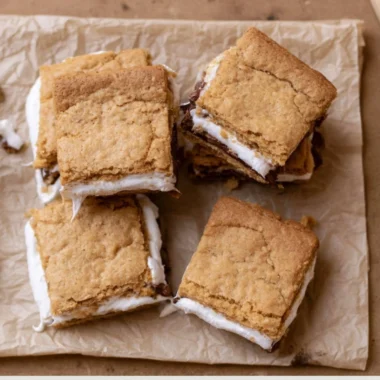 Delicious gooey S'mores Cookie Bars topped with chocolate and marshmallows.