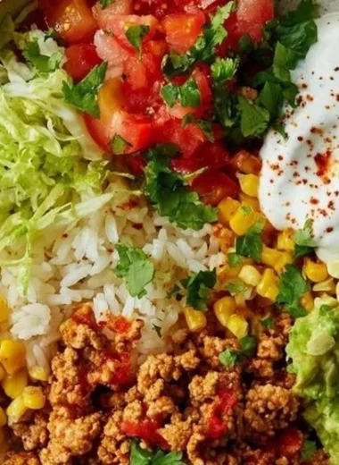 Healthy turkey taco bowl with fresh vegetables and spices
