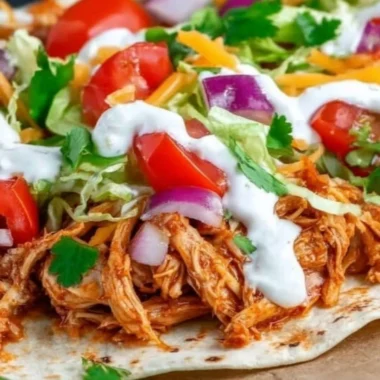 Serve of Mexican Pulled Chicken with spices and toppings