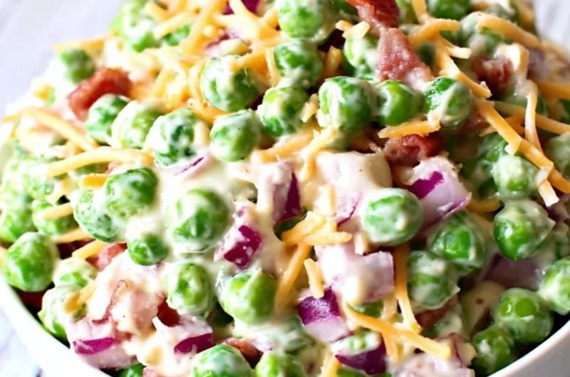 Delicious pea salad with fresh peas, herbs, and dressing served in a bowl.