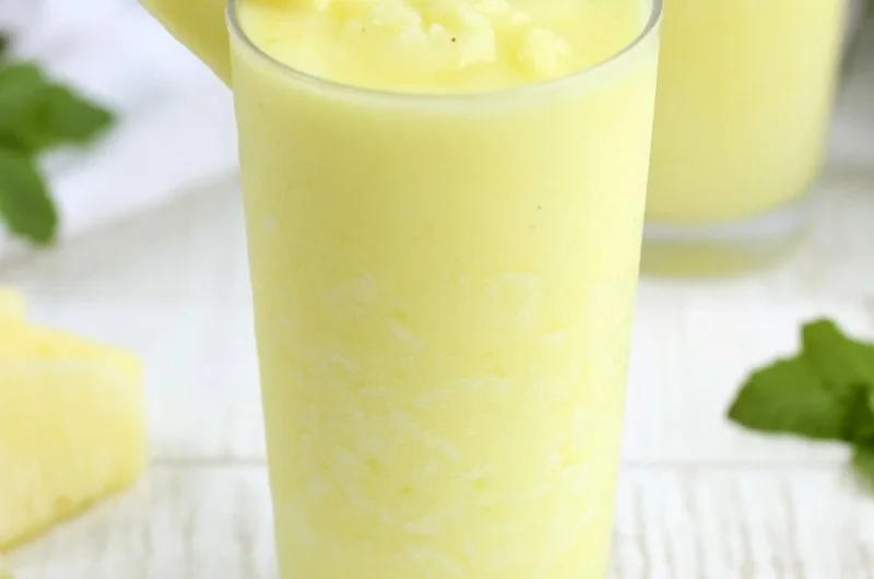 A refreshing Pineapple Rum Slush in a glass, perfect for summer cocktails.