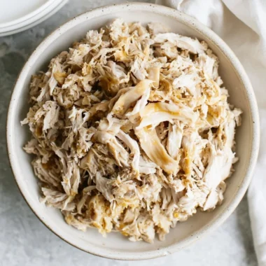 Delicious shredded chicken dish served with herbs and spices