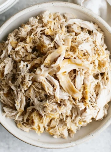 Delicious shredded chicken dish served with herbs and spices