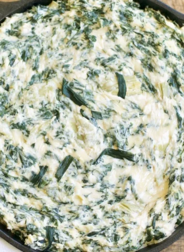 Creamy spinach artichoke dip served with crispy tortilla chips