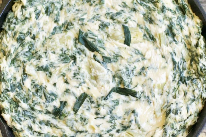 Creamy spinach artichoke dip served with crispy tortilla chips