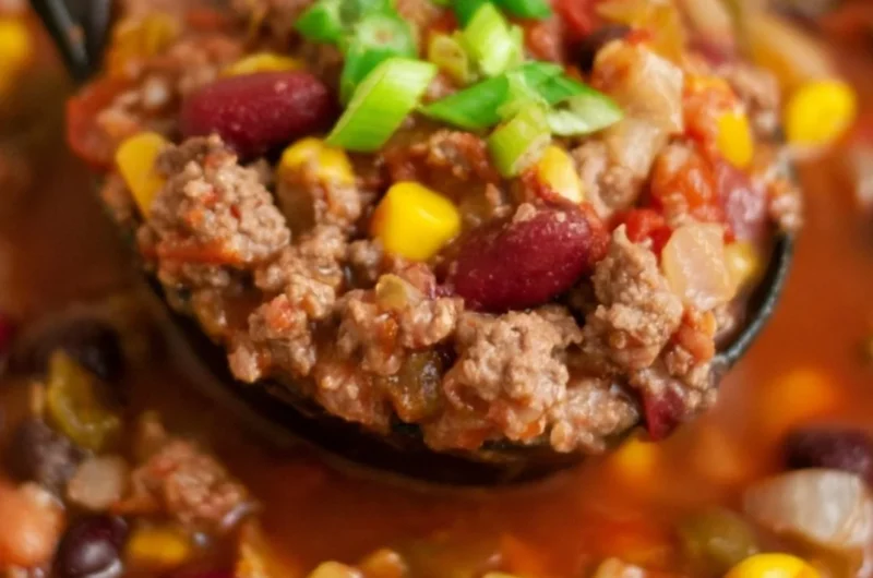 Bowl of Cozy Santa Fe Taco Soup garnished with cilantro and avocado