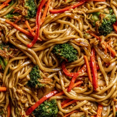 A bowl of cozy Veggie Lo Mein with colorful vegetables and noodles.
