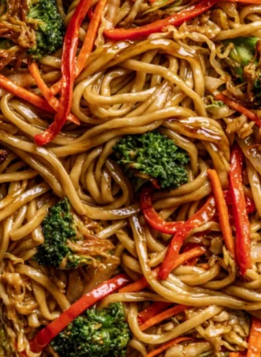 A bowl of cozy Veggie Lo Mein with colorful vegetables and noodles.