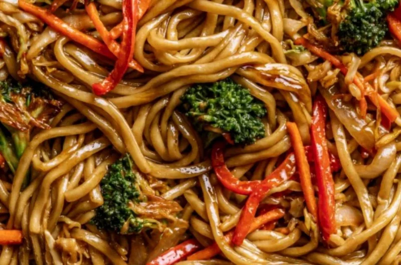 A bowl of cozy Veggie Lo Mein with colorful vegetables and noodles.