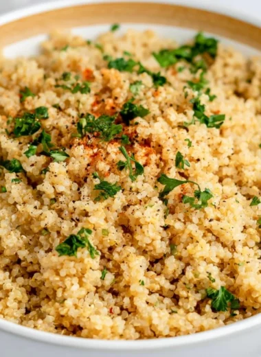 Delicious Garlic Butter Quinoa served in a bowl with fresh herbs.