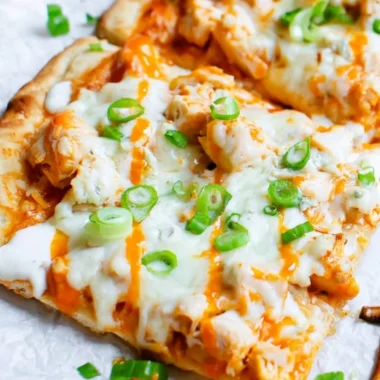 High protein buffalo chicken flatbread topped with fresh ingredients