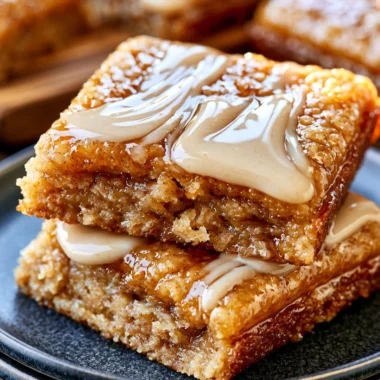 Deliciously soft baked maple donut bars on a rustic wooden table