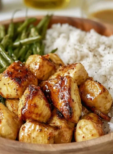 Delicious honey mustard chicken bowl with colorful vegetables and grains