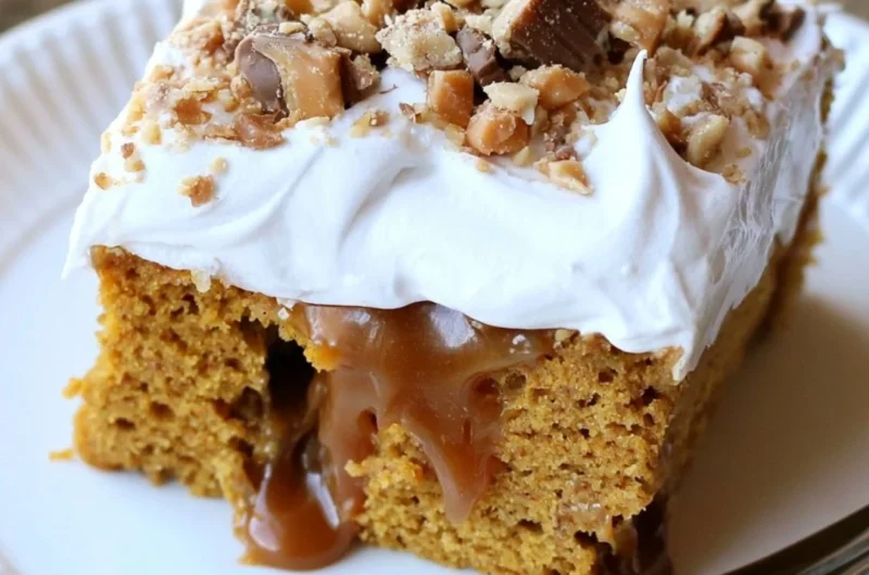 Caramel Pumpkin Poke Cake topped with caramel sauce and whipped cream