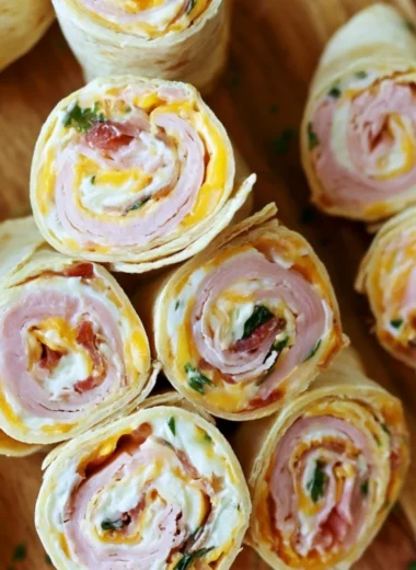 Turkey Bacon Cheese Pinwheels served on a platter with fresh vegetables