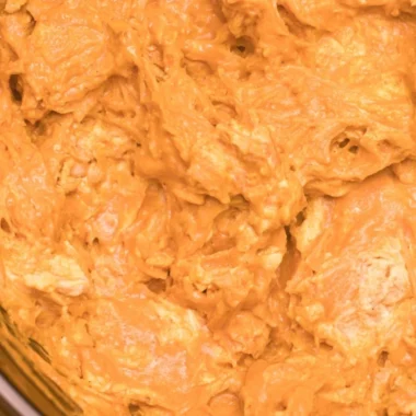 Creamy Crockpot Buffalo Chicken Dip served in a bowl with tortilla chips
