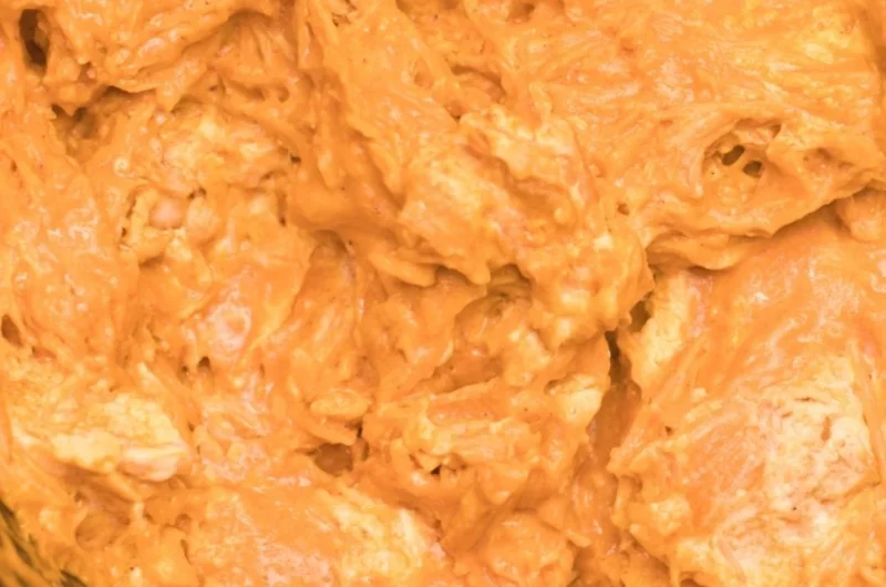 Creamy Crockpot Buffalo Chicken Dip served in a bowl with tortilla chips