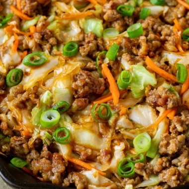 Healthy egg roll in a bowl with vibrant vegetables and savory sauce
